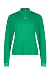 Groene top met kanten boorden.