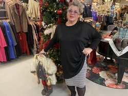 Middellange trui met glitter.